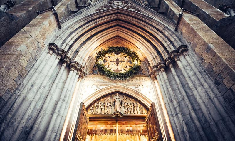 People in church with their hands raised